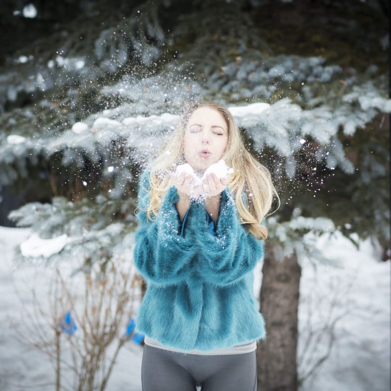 Jen Blowing Snow Outside