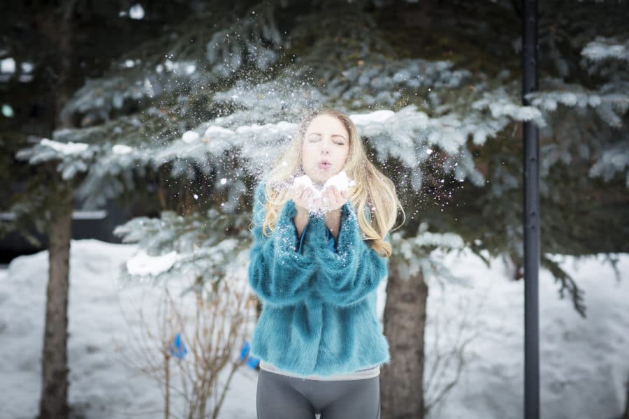 Jen Blowing Snow Outside